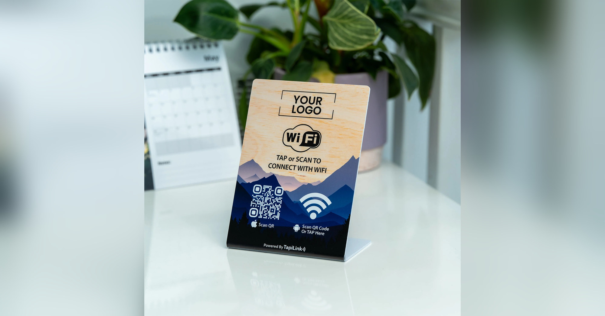 TapiLink WiFi card displayed beside a holiday let welcome pack for guests to tap or scan